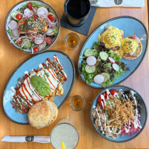 A selection of beautifully plated brunch dishes at Dime Store, showcasing the restaurant’s chef-driven approach with vibrant colors, layered textures, and creative presentation.