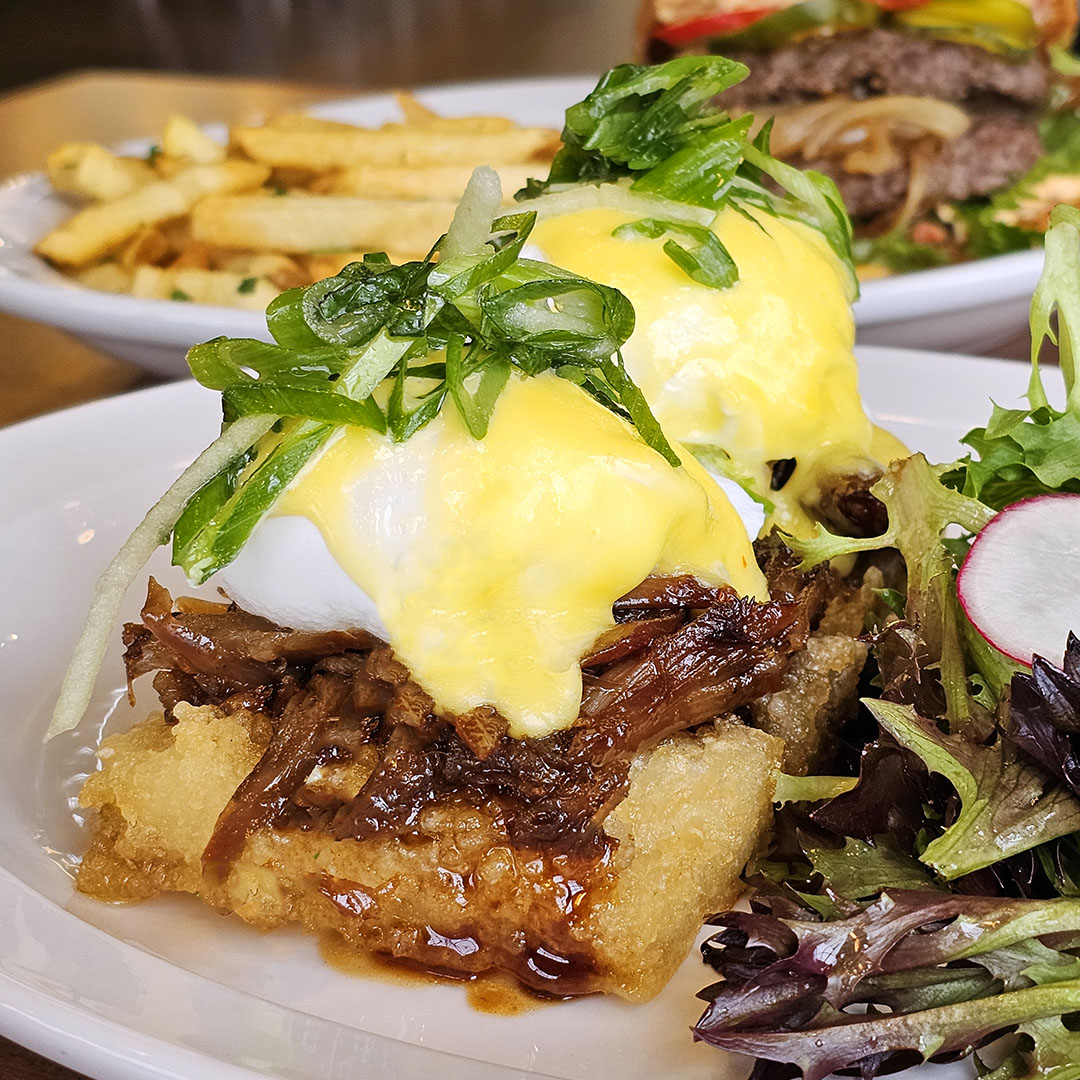Dime Store Chef's Special Peking Duck Benedict with poached eggs, scallions & hollandaise.