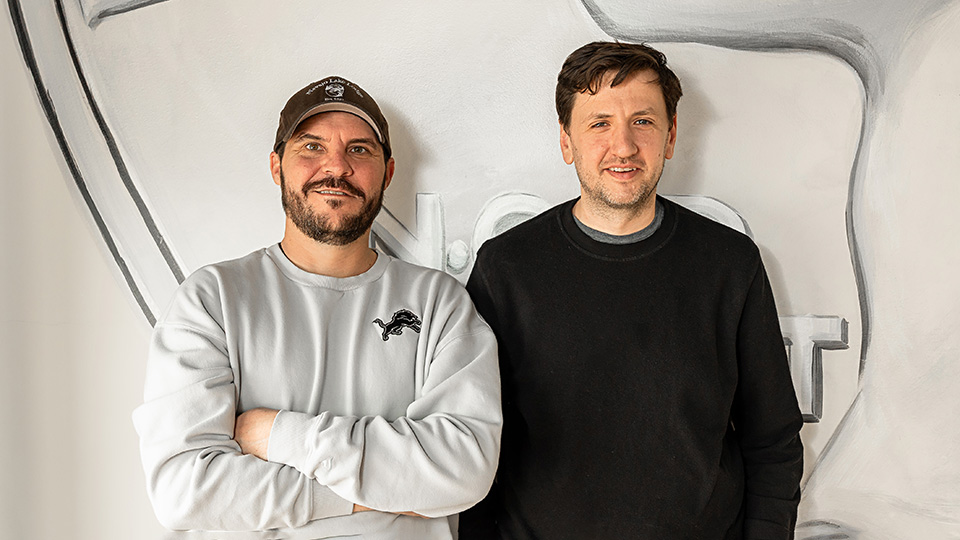 Mitch Freem and George Sleator, co-owners of Dime Store Rochester Hills, standing inside the restaurant