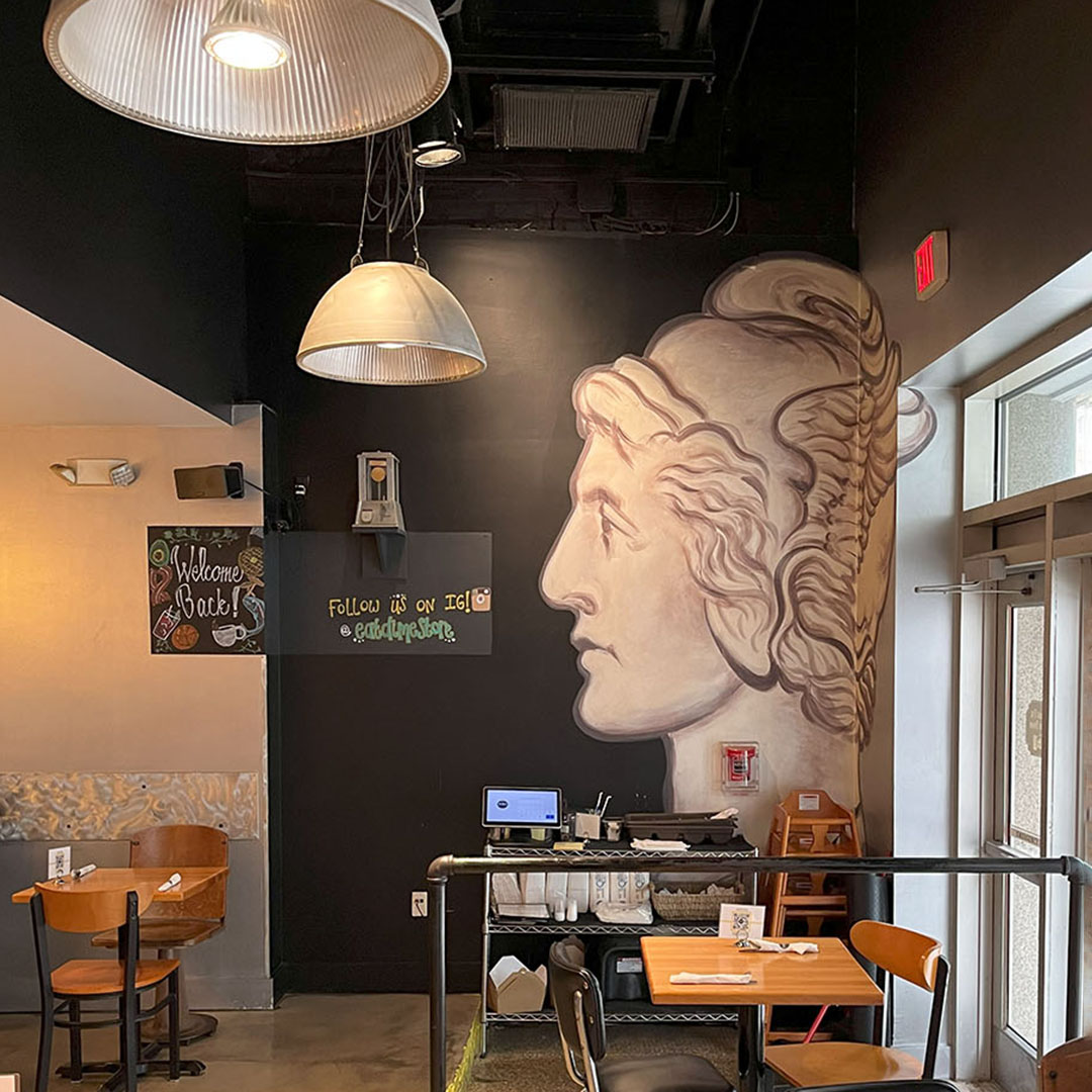 Winged Liberty mural near the entrance of Dime Store Detroit