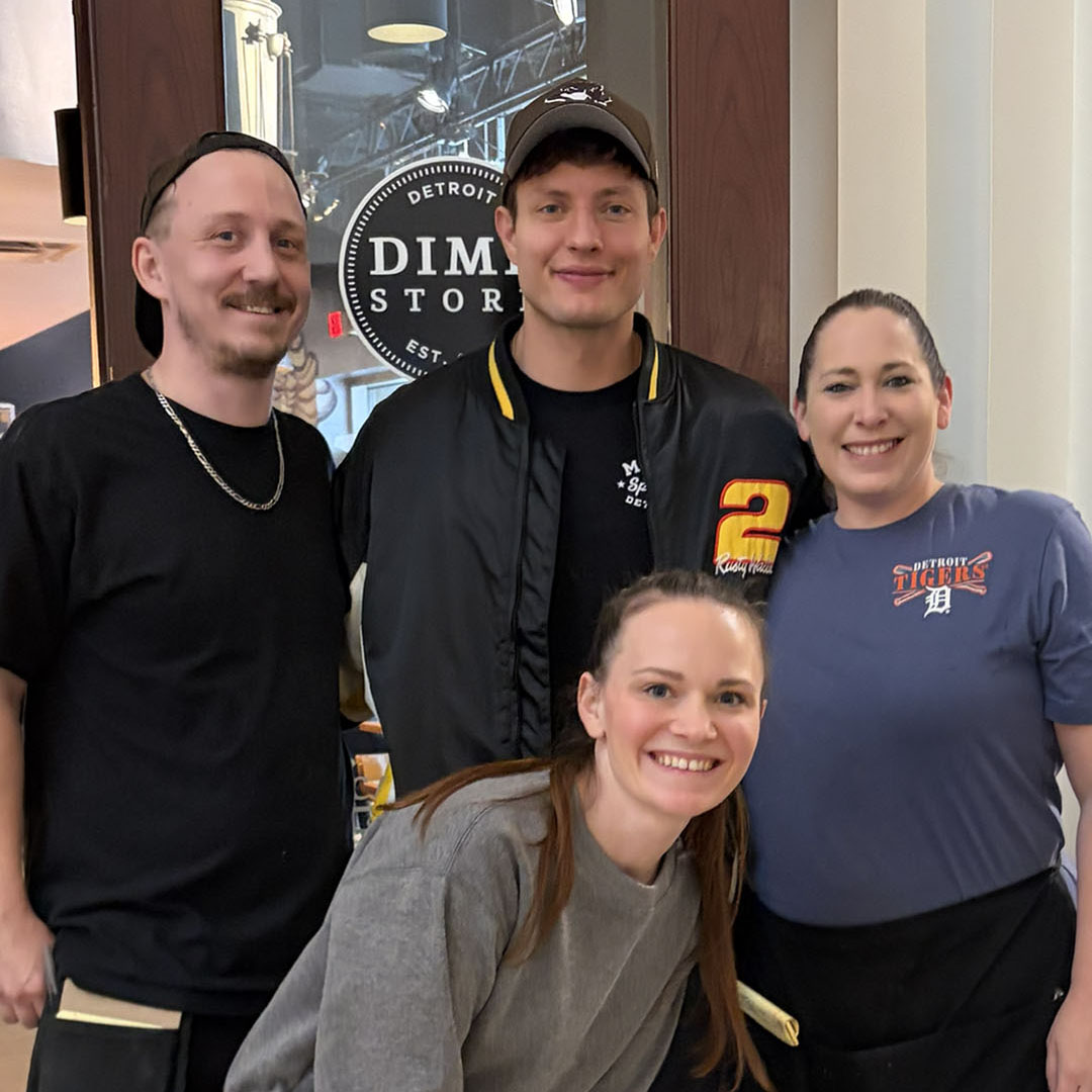 Matt Rife posing with Dime Store Detroit servers Syd, Kelly and Amber